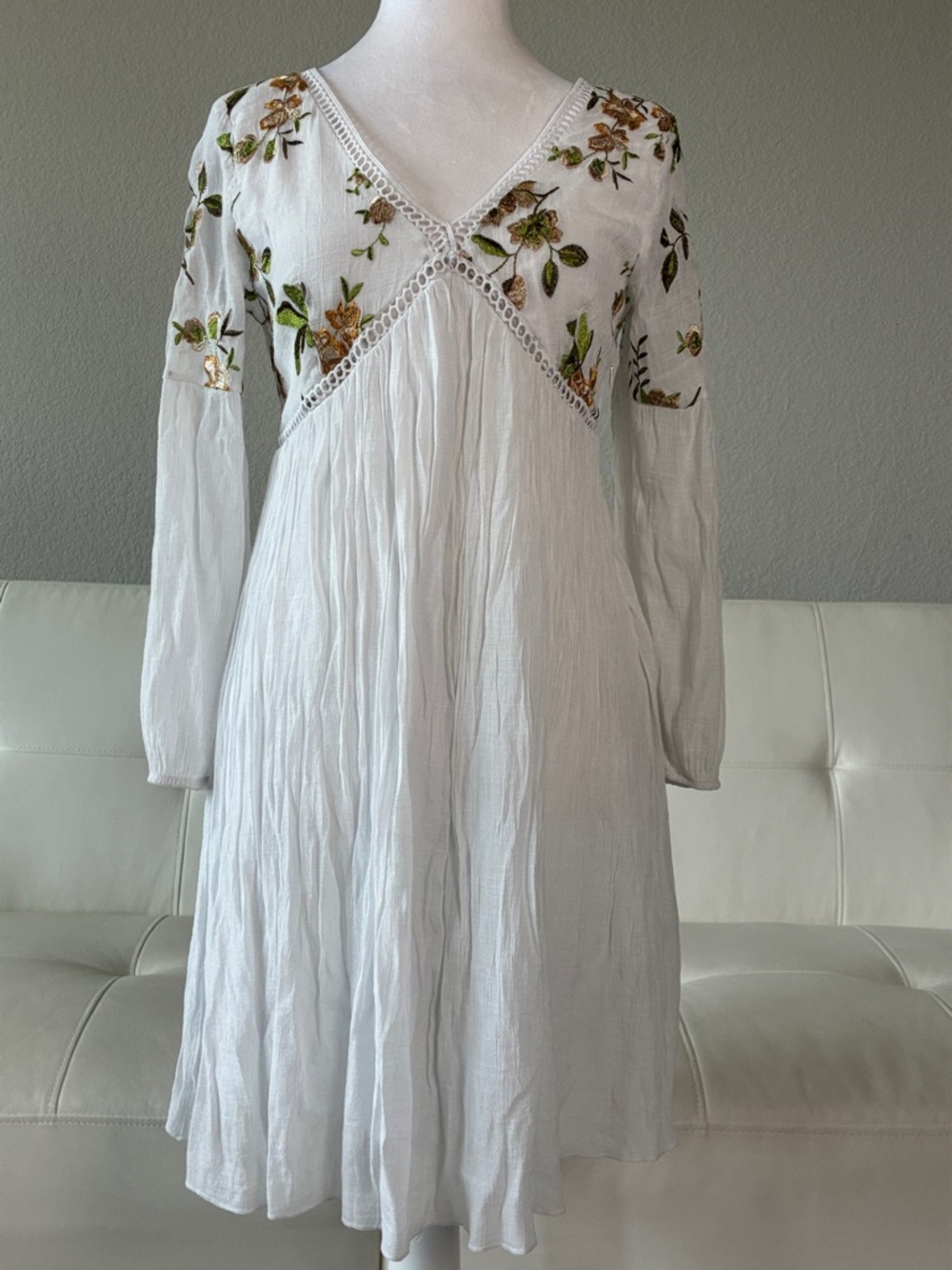 Embroidered White Long-Sleeve V-Neck Dress with Green and Gold Floral Design
